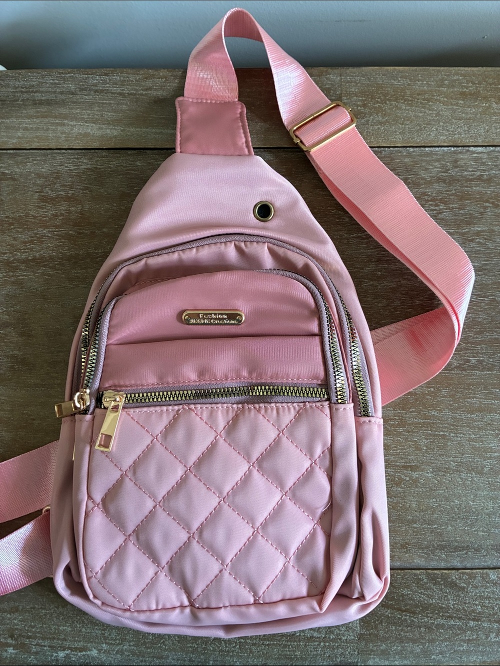 NWT Pink Quilted Sling Backpack with Gold Accents